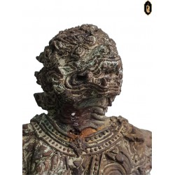 Supporting the rusted bronze devil